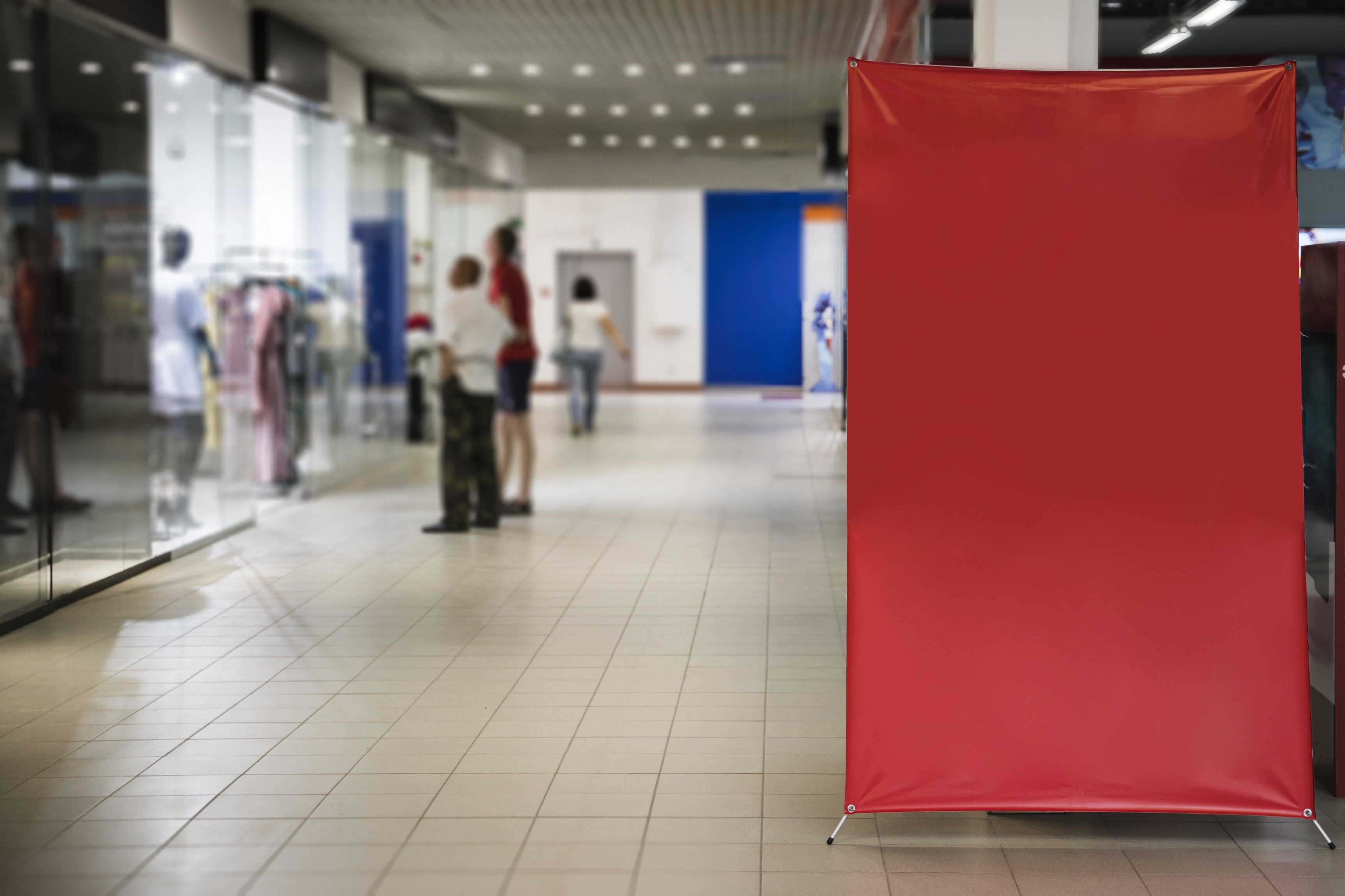 Blank red sign inside a shopping centre