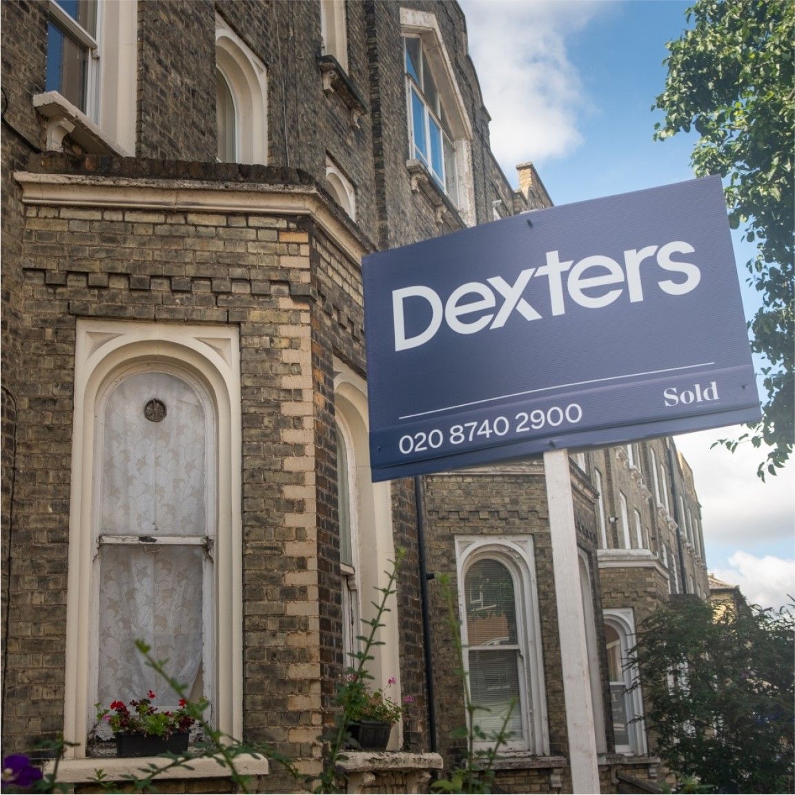 A lightweight Correx® estate agent board displayed outdoors on a residential property. The sign is securely mounted and designed for temporary outdoor use, offering a cost-effective and weather-resistant signage solution for estate agents.